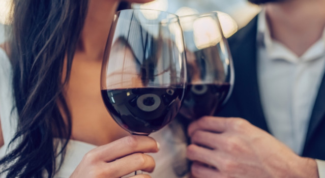 couple toasting wine